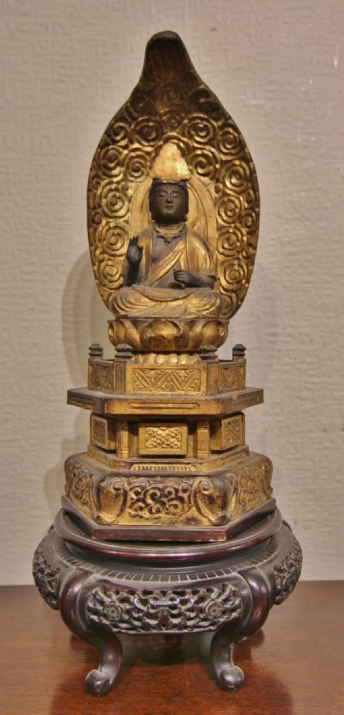 19th century carved gilt wood buddha on stand