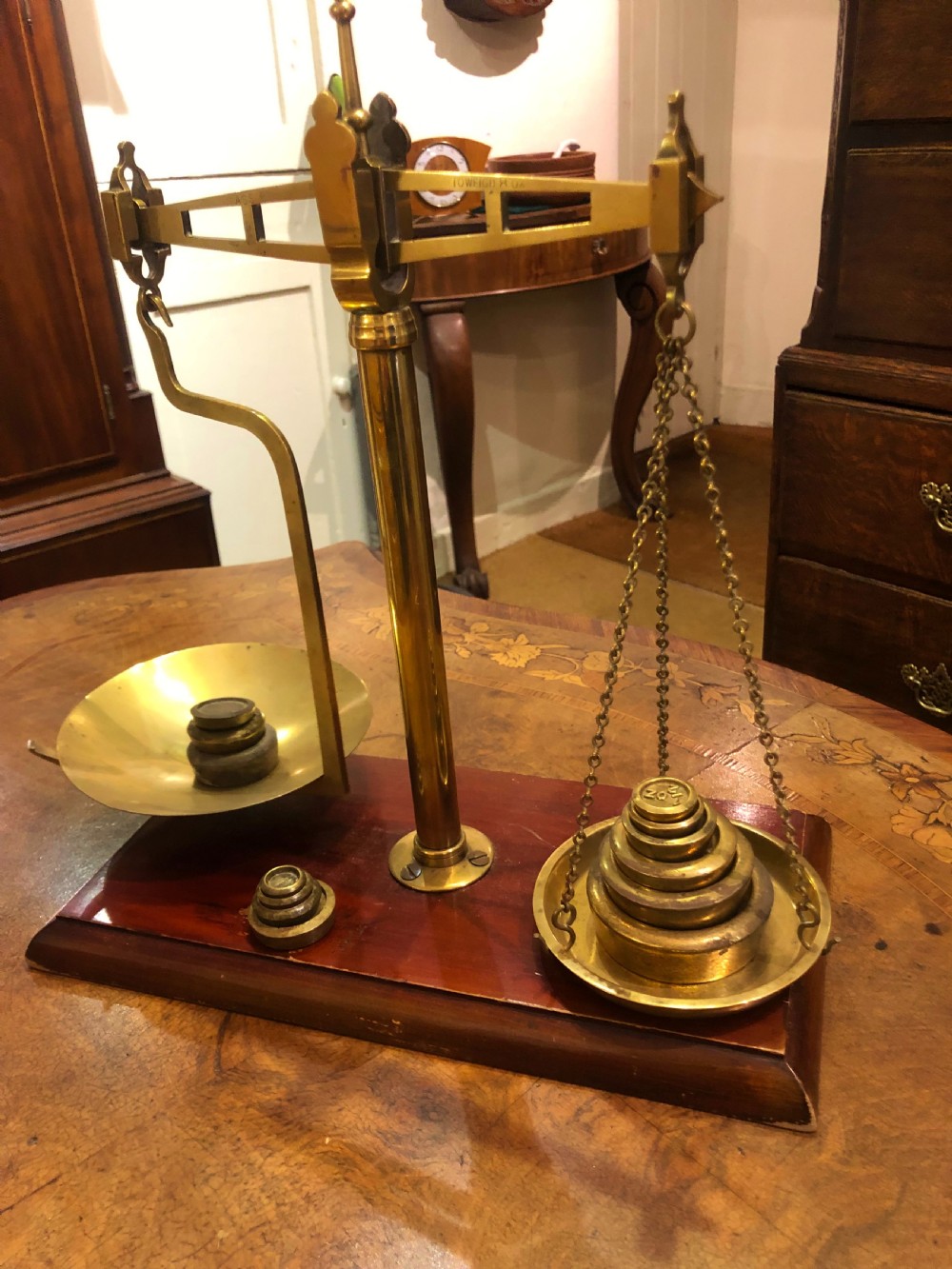 a set of brass scales with weights