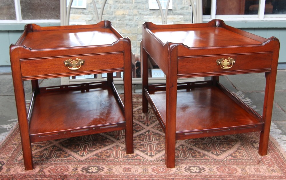 a pair of georgian style mahogany shelved bedside tables