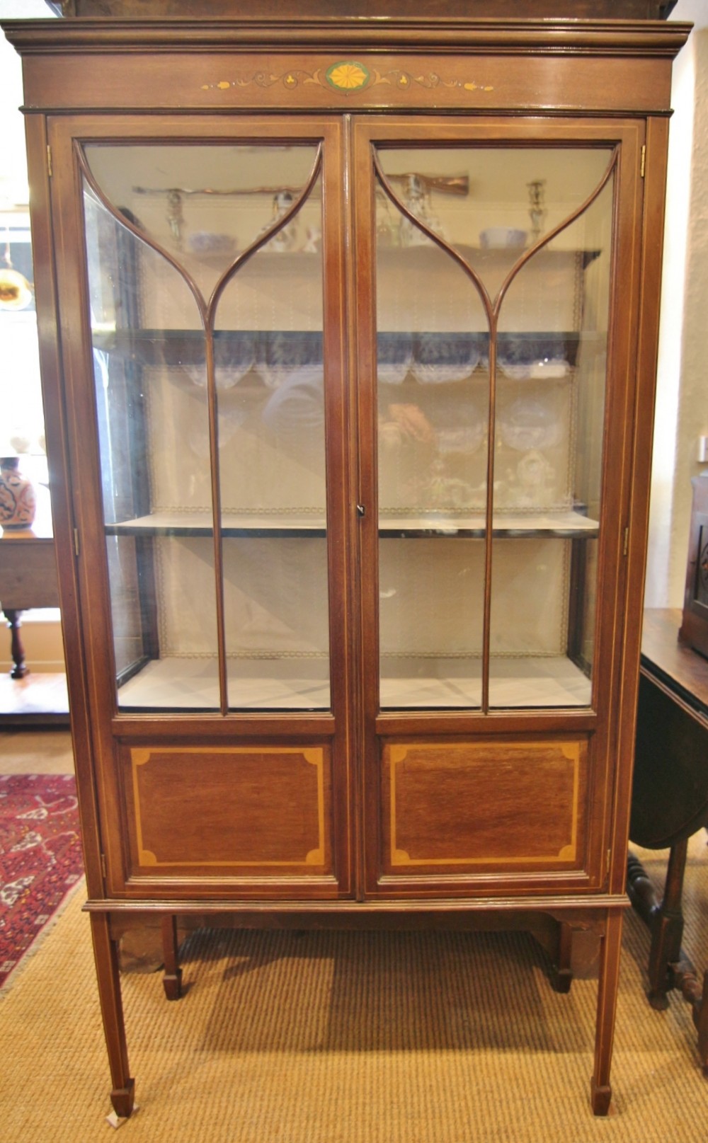 slender edwardian inlaid mahogany display cabinet